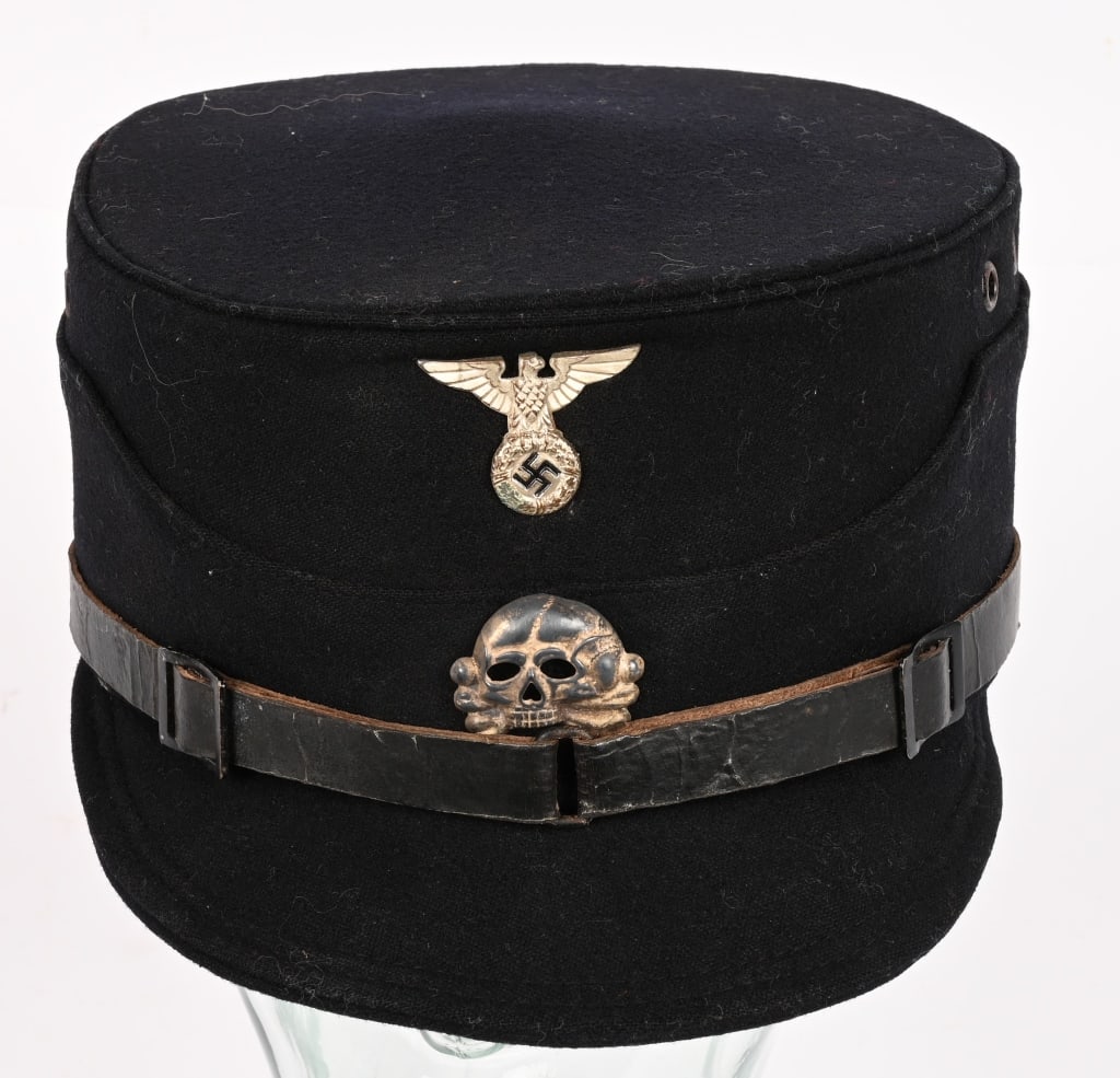 WWII NAZI GERMAN ALLGEMEINE SS KEPI SCHAFTMUTZ: This kepi was the original headgear of the SS before the major change to the uniform in 1932 when the kepi was replaced by the peaked cap. The kepi is of black felt; it has a flat circular top and a s