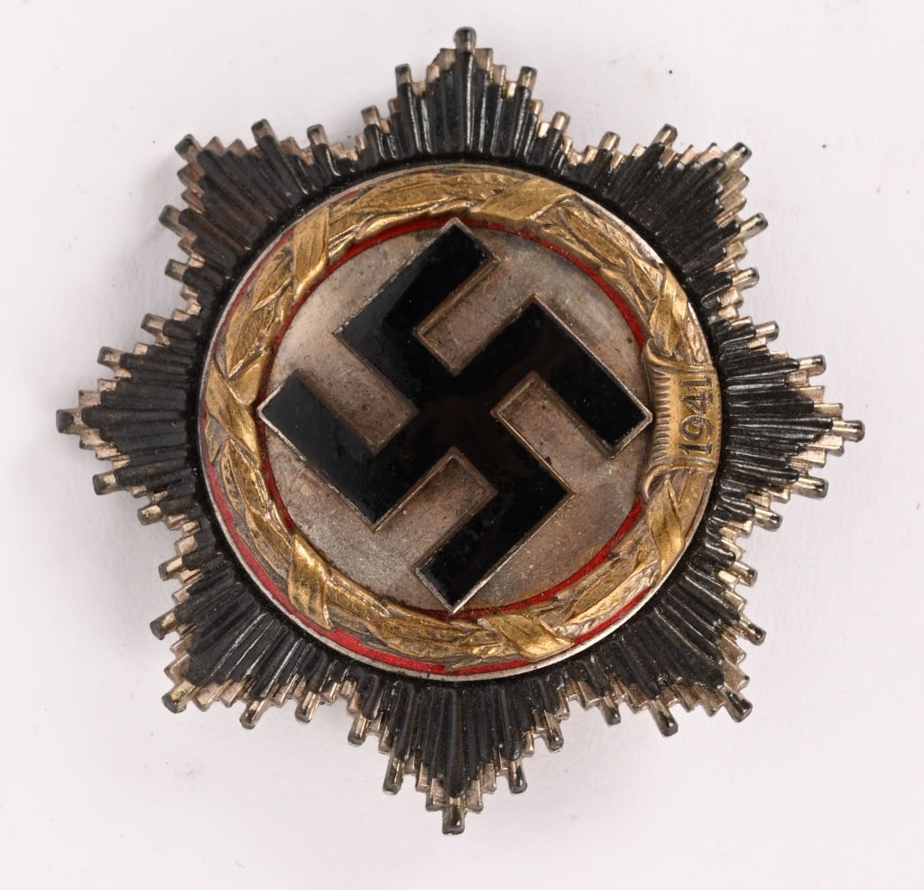 WWII NAZI GERMAN CROSS IN GOLD BY 1 DESCHLER WW2: Five piece, slightly convexed, die struck, light (cupal) construction badge with black and red enamel work. The cross features a double, overlaid, eight point, sunburst pattern with the top sunburst l