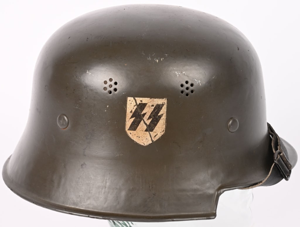 WWII M34 SS EDELSTAHL DOUBLE DECAL HELMET WW2: WWII Nazi German M34 civil type SS helmet, having both Pocher made decals on each side, showing nice aging and patina. Liner is complete but chin strap. There are no visible markings present. Germanhe