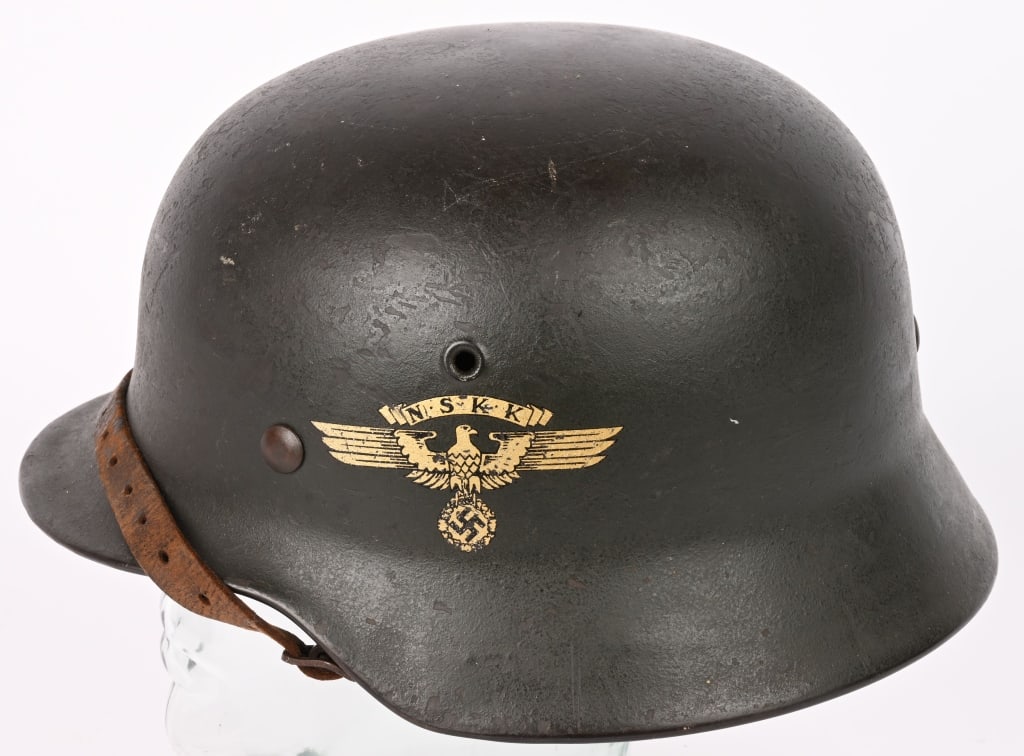 WWII NAZI GERMAN NSKK M40 COMBAT HELMET WW2: One of the very difficult helmets of the Third Reich to obtain is the NSKK helmet size ET64. This is an NSKK Luftwaffe Brigade helmet having most of its original Field gray finish. All three liner ret