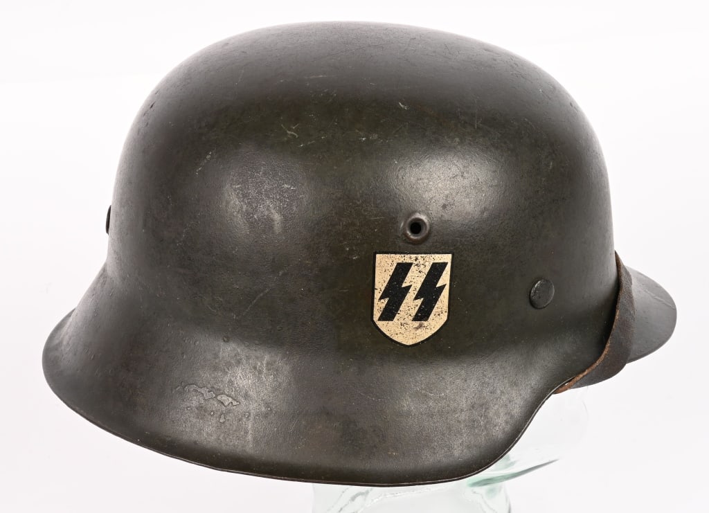 WWII NAZI GERMAN WAFFEN SS M42 DOUBLE DECAL HELMET: The stamped sheet steel construction helmet retains about 94% of its original field-gray paint. The right side of the helmet has a second pattern, "SS" runic decal with black runes on a silver shield 