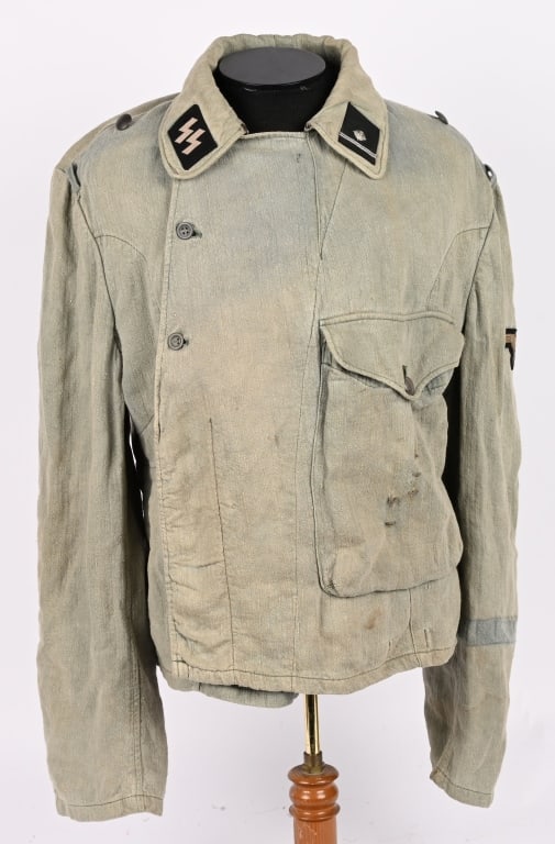 WWII NAZI GERMAN WAFFEN SS PANZER HBT WRAPPER WW2: WWII Nazi German Waffen SS HBT Wrapper that is well marked to the interior. To the collar are the SS runic tab and an Oberjunker rank tab. To the sleeve is a Dachau made SS Sleeve Eagle. Clearly