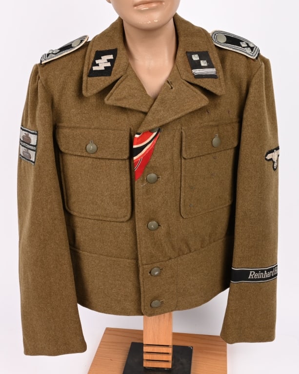 WWII NAZI WAFFEN SS REINHARD HEYDRICH M44 TUNIC: Short, waist length, field-gray/brown wool/rayon blend construction tunic with six button front closure and lay down collar. Tunic has two non-pleated breast patch pockets with straight button down fl