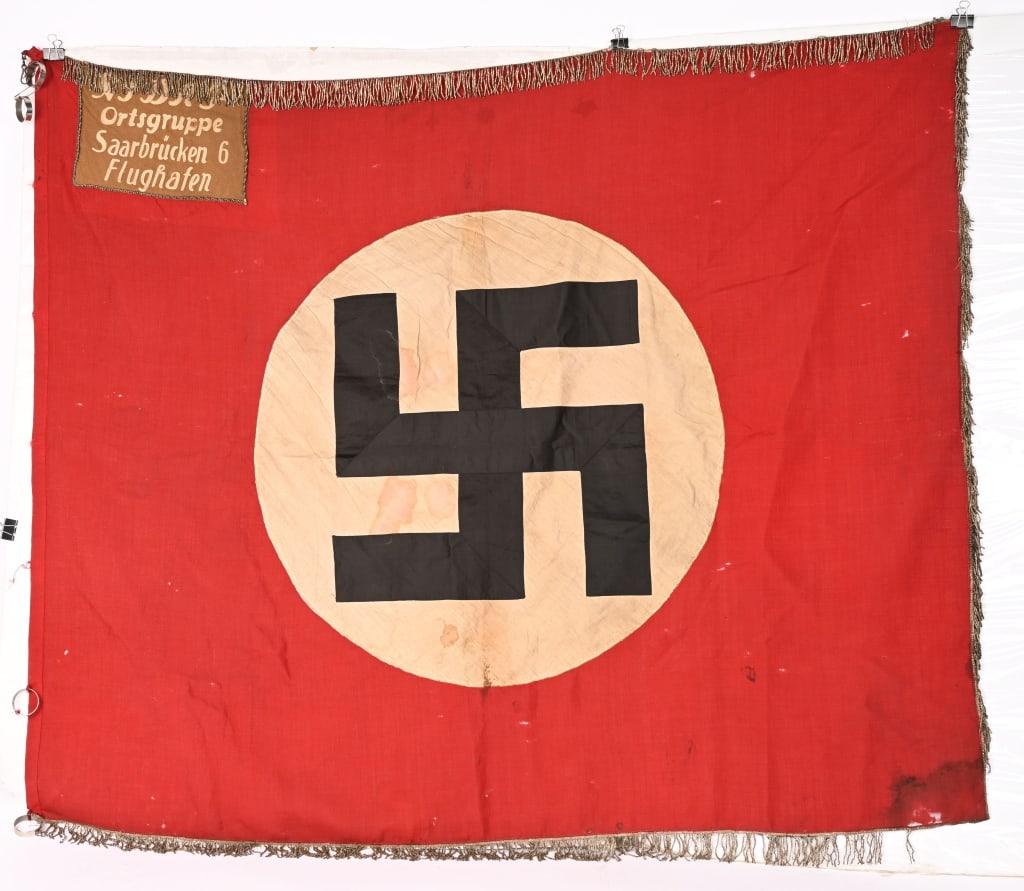 WWII NAZI GERMAN NSDAP ORTS FLAG SAARBRUCKEN WW2: WWII Nazi German flag is for the town of Saarbrücken 6 Flughafen which is the Airport in Saarbrücken. This Orts level flag measures 46 inches X 54 inches showing minimal wear into the 