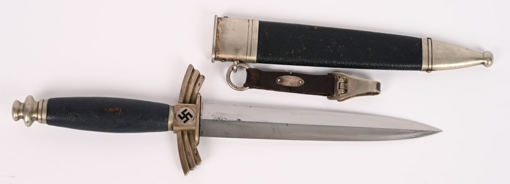 WWII NAZI GERMAN DLV DAGGER, SMF w/ SCABBARD WW2: DLV glider pilot’s dagger. The 17cm long silver/nickel plated blade is in excellent condition Maker marked "SMF". Solid nickel/silver cross guard and pommel. Black enameled swastika to both side