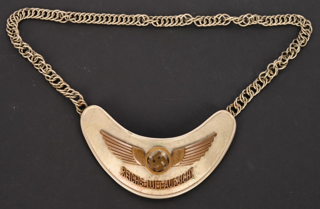 WWII LUFTWAFFE AIR TRAFFIC CONTROLLER'S GORGET WW2: Gorgets hold an interesting place in history, as they are a throw-back to the days of knights, when suits of armor included a neck protection device called a Gorget. They have been used since that tim