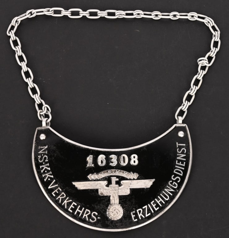 WWII NAZI NSKK TRAFFIC SERVICE GORGET WW2: A scarce NSKK (National Socialist Motor Corps/Nationalsozialistisches Kraftfahrkorps) Traffic Educator/Verkehrserziehungsdienst gorget; in aluminum; numbered “16308” on the obverse; raised