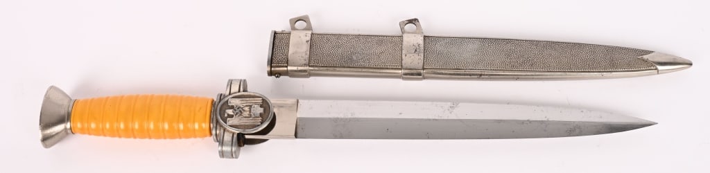 WWII NAZI GERMANY SOCIAL WELFARE DAGGER & SHEATH: Roughly 25cm long, dual edged, nickel/silver plated, drop forged steel blade with a raised central spine and large flat ricasso. The blade is unmarked. The thick blackened leather washer is still inta