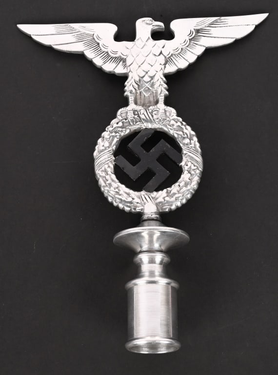 WWII NAZI GERMAN EARLY NSDAP POLE TOP WW2: EARLY NSDAP POLITICAL FLAG POLE FINIAL. An aluminum flag pole finial, in the form of an eagle whose outstretched wings have a span of 7 3/4 inches and which clutches a wreathed, mobile swastika in its