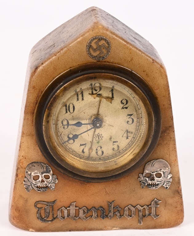 WWII NAZI GERMAN DESK CLOCK WAFFEN SS TOTENKOPF: A very attractive Alabaster Desk Clock measuring 4 1/2 inches tall.The movement is marked Junghans from Schramberg Germany. To the front of the Alabaster h clock housing is an applied Swastika to