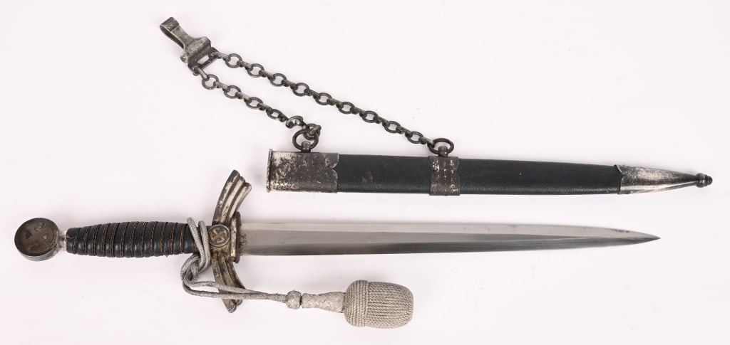 WWII NAZI GERMAN 1st MODEL LUFTWAFFE DAGGER WW2: Early (circa 1936-1937) roughly 30.5cm long bright nickel/silver plated drop forged steel double edged stiletto style blade with a flat central plane. The blade is excellent. The original pebbled, blu