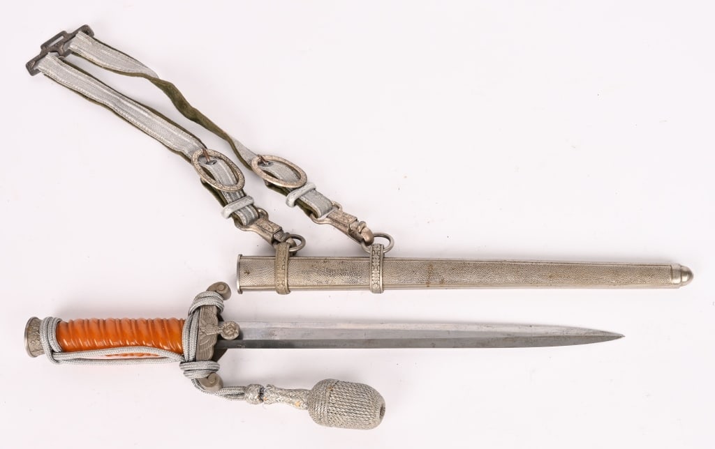 WWII NAZI GERMAN HEER OFFICER'S DAGGER W HANGERS: The dagger features a roughly 26cm long drop forged steel construction nickel/silver plated stiletto style blade with a flat central ridge and a full length including the hilt of roughly 38cm. Nice cl