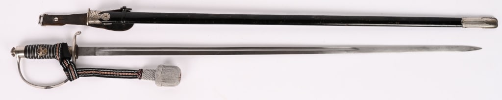 WWII NAZI GERMAN POLICE NCO SWORD W/ KNOT WW2: WWII German Police sword Ricasso is maker marked " Paul Weyersberg & Co. Solingen " Blade is in excellent untouched condition. Grips and wire wrap in excellent tight condition and feature applied poli