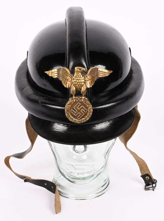 WWII NAZI GERMAN NSKK LEATHER CRASH HELMET WW2: Molded, smooth, blackened leather helmet with raised, padded, protective bars running horizontally around the helmet's bottom edge, and another one running from front to back over the crown top. Helme