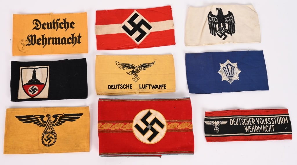 WWII NAZI GERMAN ARMBAND LOT ORTS LEVEL NSDAP WW2: WWII Nazi German Armband lot to include 1) WWII NAZI GERMAN ORTS LEVEL NSDAP ARMBAND WW2. NSDAP Orts Level Administration Political Leader’s Armband – constructed of red wool, centering bl