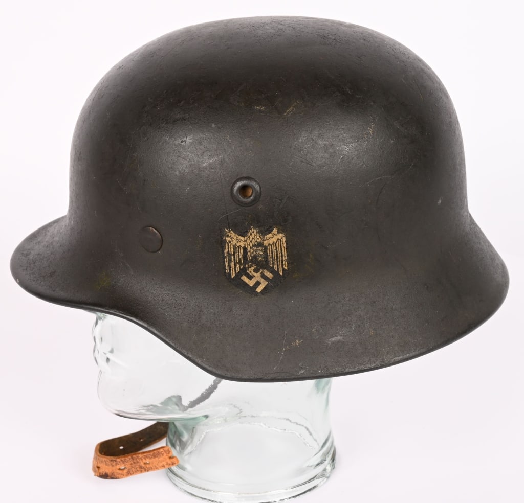 WWII NAZI GERMAN M40 SD ARMY HELMET Q64 WW2: The stamped sheet steel construction helmet retains most of its original paint. The left side of the helmet has a Wehrmacht eagle decal which is retained about 70%. All three liner retaining rivets an
