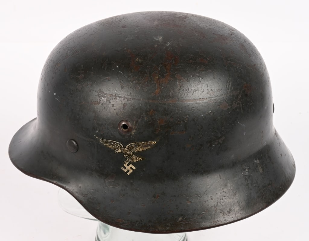WWII NAZI M35 LUFTWAFFE DD COMBAT HELMET ET68 WW2: The stamped Luftwaffe sheet steel construction helmet retains most of its smooth gray finish. The 1st pattern Snake Leg Luftwaffe eagle decal is retained about 90%. The National Shield is retaine