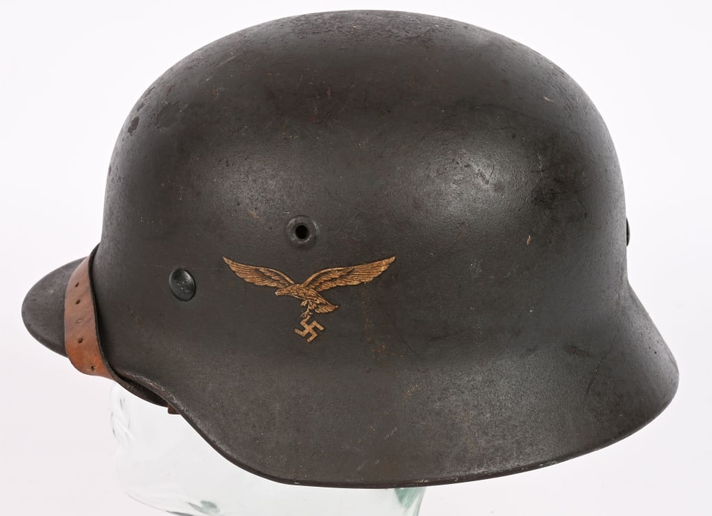 WWII NAZI GERMAN M40 LUFTWAFFE HELMET W LINER Q64: The stamped, sheet steel construction M40 helmet retains most of its slightly rough textured, Luftwaffe blue/gray paint. The left side of the helmet has a second pattern, (circa 1936/1937-1945), Luftw