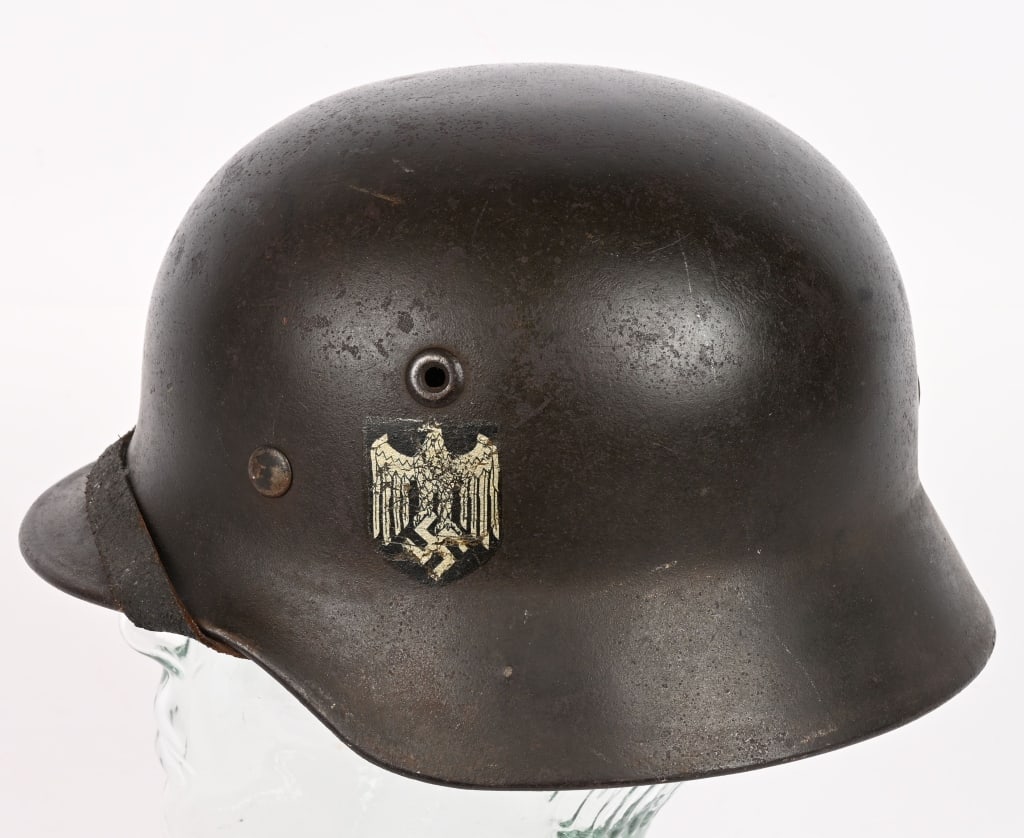 WWII NAZI GERMAN ARMY M40 DD HELMET Q62 WW2 NAMED: The stamped, sheet steel construction helmet retains about most of its field-gray paint. The left side of the helmet has a Wehrmacht eagle shield decal which is retained about 95%. The right side Nati