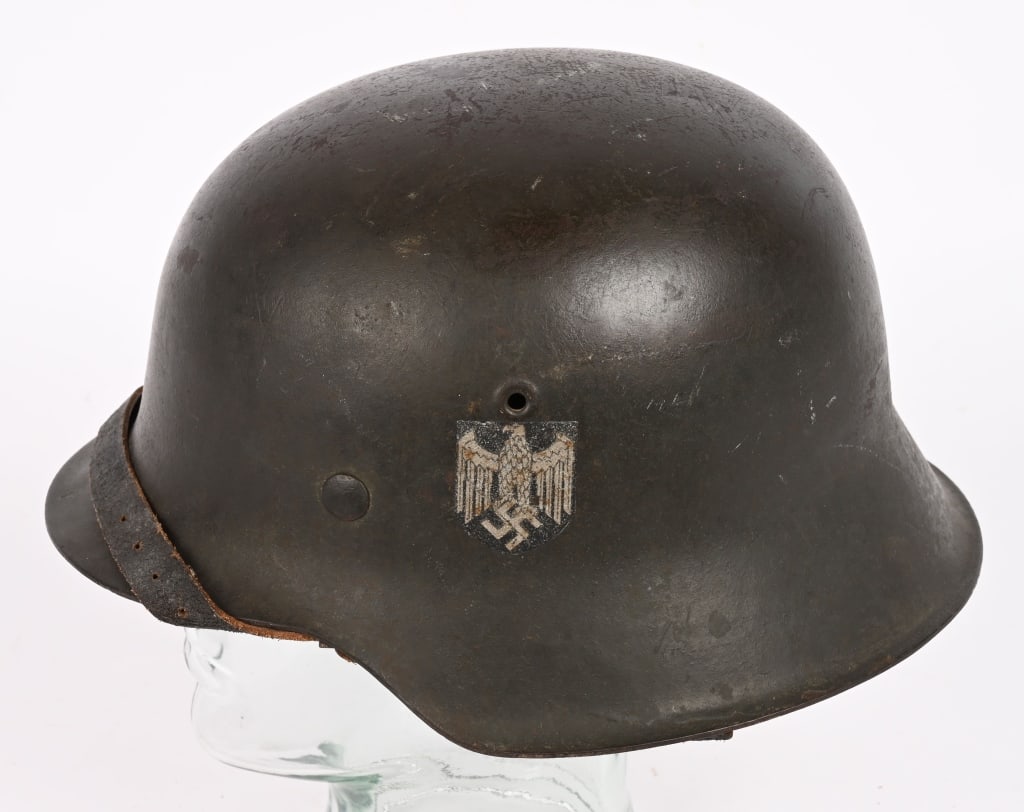 WWII NAZI GERMAN M42 EF64 SD HEER HELMET W LINER: The stamped, sheet steel construction helmet retains all of its field-gray paint. The left side of the helmet has a Wehrmacht eagle shield decal which is retained about 95%. All three liner retaining 
