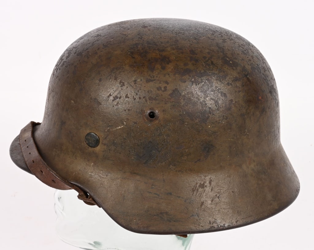 WWII NAZI GERMAN MEDITERRANEAN CAMO HELMET WW2: M35 helmet with Mediterranean overpaint camouflage. Helmet has a dark tan color Camo. Helmet & liner are complete. Rear of the helmet is stamped with a lot number 4173. The side of the helmet is 