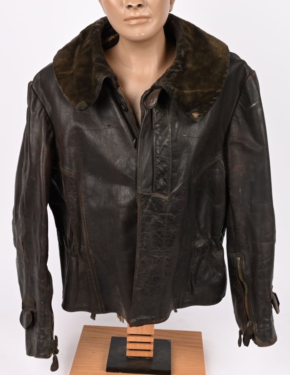 WWII NAZI GERMAN LEATHER FLIGHT JACKET LATE WAR: Constructed with a fine brown leather exterior and a combined dark gray felt and light gray rayon liner, this jacket is tagged on the interior but has been washed out, with a twill-lined exterior brea