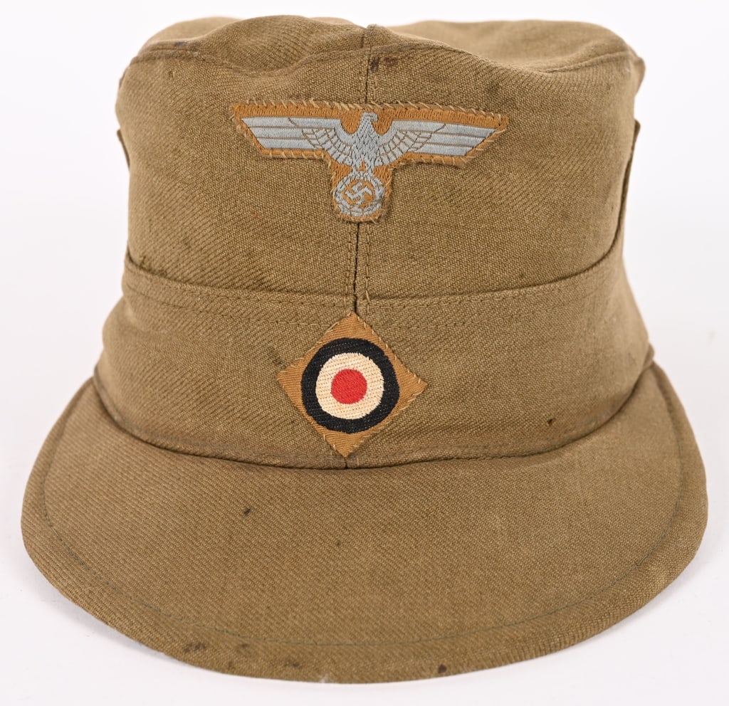 WWII NAZI GERMAN HEER M41 TROPICAL FIELD CAP WW2: Ribbed olive/khaki cotton twill construction cap features, dual-ply, stitched down side and back panels with a gently scalloped downward slope to the front center. The cap has ventilation grommets to 