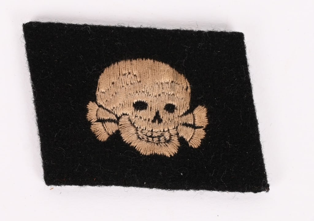 WWII NAZI WAFFEN SS TOTENKOPF EM/NCO’S COLLAR TAB: Right hand side, unit designation, collar tab features a machine embroidered, horizontally positioned, skull superimposed over crossed bones in silvery/grey threads on a black wool base. The skull has