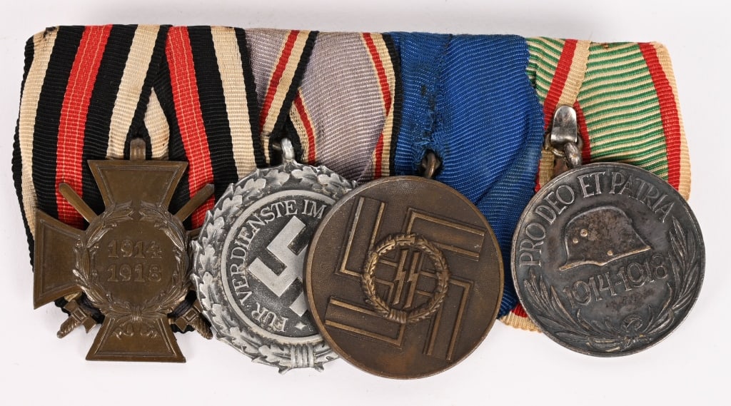 WW1 IMPERIAL & NAZI GERMAN & SS 8 YEAR MEDAL BAR: A very attractive 4 place medal bar to include 1) COMBATANTS CROSS OF HONOR 1914/18. Die struck, magnetic sheet metal award with a bronze wash. The award is in the form of a cross Patté with a ce