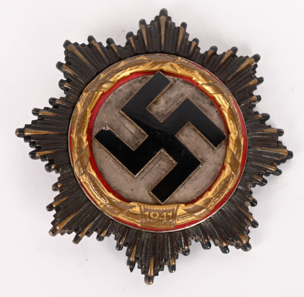 WWII NAZI GERMAN CROSS IN GOLD BY 1 DESCHLER WW2: Five piece, slightly convexed, die struck, light (cupal) construction badge with black and red enamel work. The cross features a double, overlaid, eight point, sunburst pattern with the top sunburst l