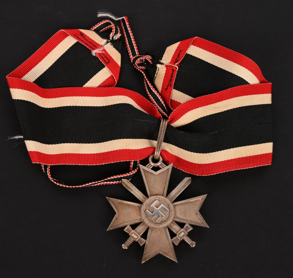 WWII GERMAN KNIGHTS CROSS OF THE WAR MERIT CROSS: A nice example of a Knights Cross of the War Merit Cross with Swords. The Knights Cross of the War Merit Cross with Swords is made out of “900” silver with additional silver frosting and b