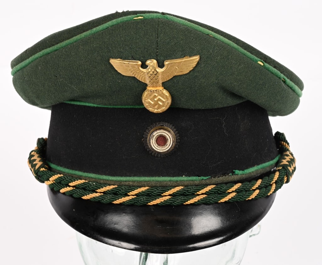 WWII NAZI GERMAN PRISON OFFICIALS VISOR HAT WW2: Green wool top with black cap band. Green piping. Golden metal eagle/swastika and metal cockade, along with golden yellow and green entwined capcords. Interior with light brown cotton lining. Celluloi