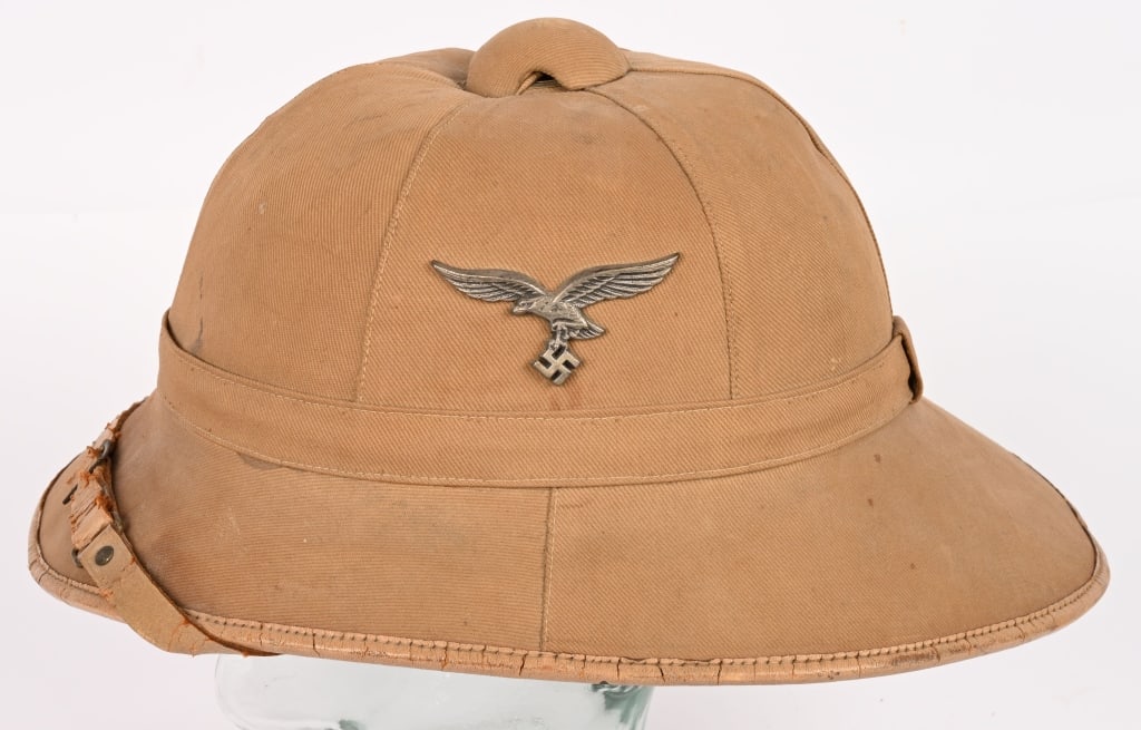 WWII NAZI GERMAN LUFTWAFFE TROPICAL PITH HELMET 56: Luftwaffe issue, tropical pith helmet, with a formed cork core covered in a ribbed, light tan cotton twill. The helmet features a six panel, vertically seamed, tan cotton twill crown with a horizontal