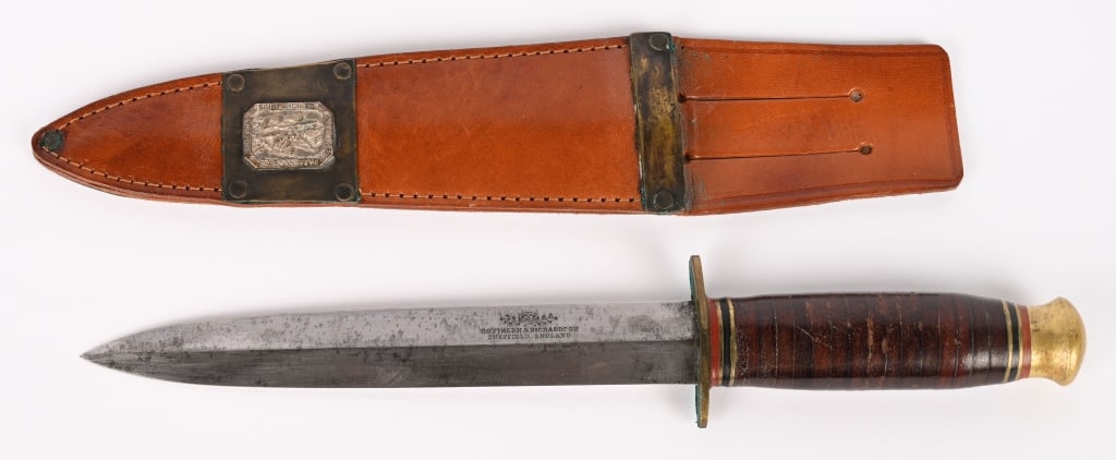 WWII NAMED PRESENTATION FIGHTING KNIFE 503rd PIR: WWII Named Fighting Knife and Scabbard manufactured by Southern & Richardson of Sheffield England and is engraved to Lt. Col Tolson on the blade. The leather washer handle is still tight with a brass