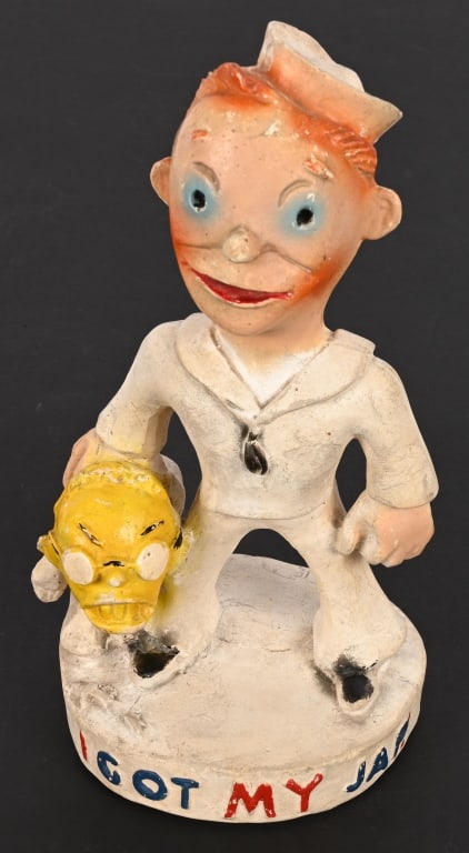 WWII ANTI AXIS I GOT MY JAP! PLASTER STATUE USN: 9.75" tall solid plaster statue. Base says "I Got My Jap!"in patriotic colors. Sailor holds a small stereotypical Japanese Soldier wearing Coke Bottle Glasses showing his teeth. Back of base has