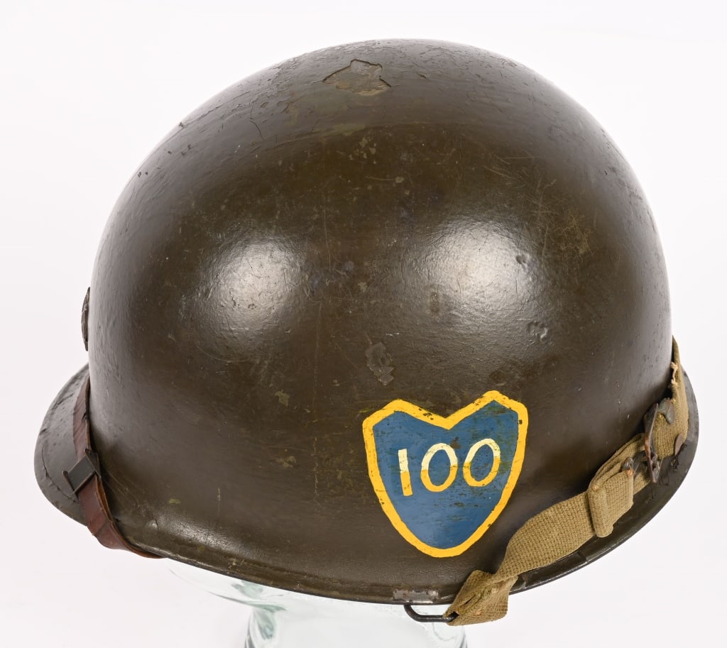WWII US 100TH DIVISION OFFICER PAINTED HELMET: 100th Division Helmet with Applied Lieutenant Colonel insignia to the front. This swivel bale front seam helmet bears the insignia of the 100th that is hand painted and in excellent condition. Th