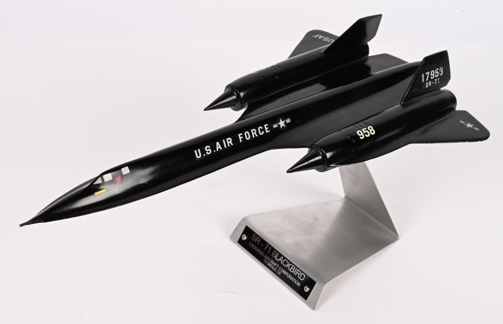 SR-71 BLACKBIRD DESK MODEL BY LOCKHEED: SR-71 Blackbird Desk model measuring 17 1/2 inches long and made of painted metal. Excellent. The Lockheed SR-71 "Blackbird" is a retired long-range, high-altitude, Mach 3+ strategic reconnaissan