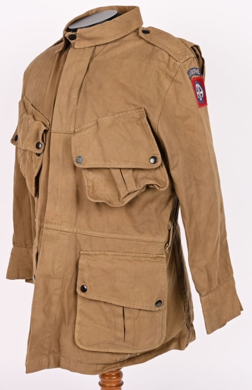 WWII M42 SAVING PRIVATE RYAN AIRBORNE JUMP SUIT: WWII 82nd Airborne M42 Jump Suit complete with Jump Jacket & Matching Trousers. The jacket is roughly a size 38R and is marked to the interior U.S. SPR. Excellent. Saving Private Ryan is a 1998