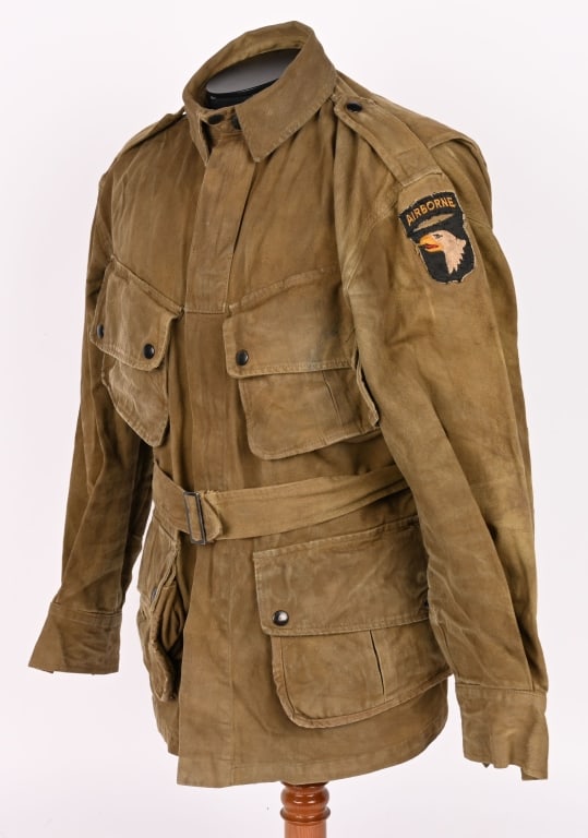 WWII M42 SAVING PRIVATE RYAN AIRBORNE JUMP SUIT: WWII Reinforced 101st M42 Jump Suit complete with Jump Jacket & Matching Trousers. The jacket is roughly a size 40 and is marked to the interior U.S. SPR. Excellent. Saving Private Ryan is a 1998