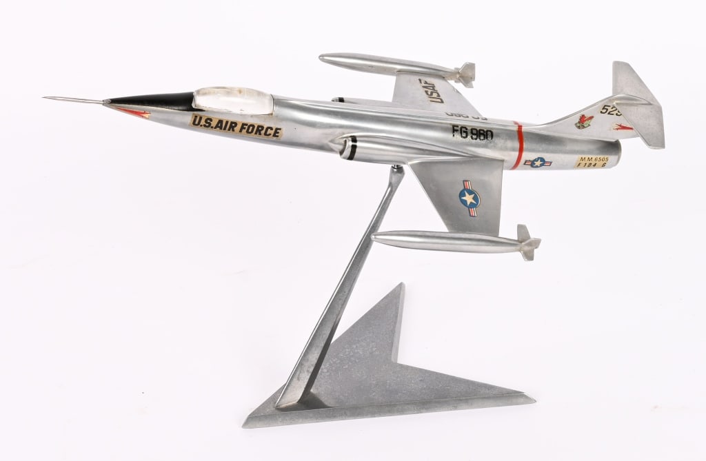 LOCKHEED F-104G STARFIGHTER DESK MODEL: A beautiful Polished Aluminum Desk model of the Lockheed F-104G measuring 13 3/4 inches long in excellent condition. The Lockheed F-104 Starfighter is an American single-engine, supersonic interc