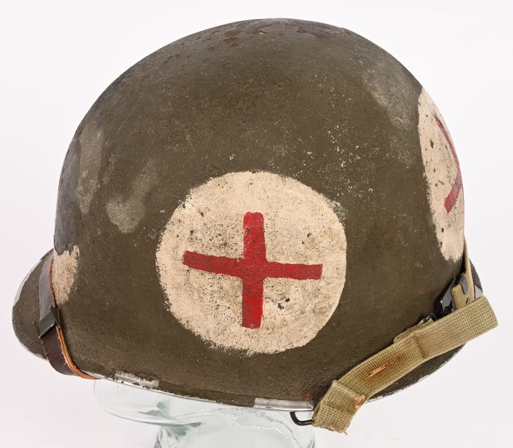 WWII US MARINE / NAVY CORPSMAN PAINTED HELMET WW2: A swivel bale M1 Combat Corpsman painted helmet with a Westinghouse Liner that is also Corpsman Marked. The helmet has been over painted with a very coarse sand finish making me think its a