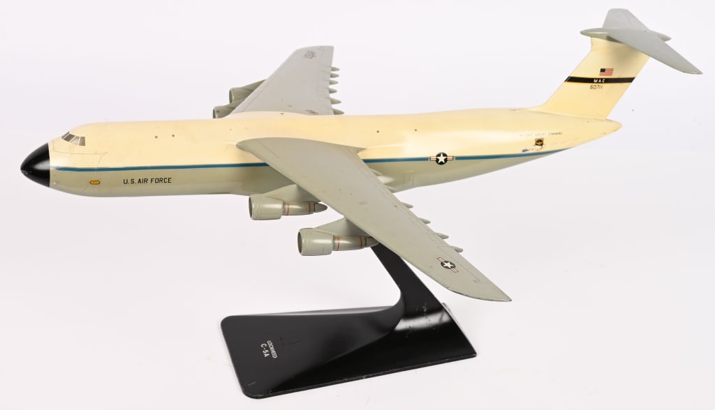 LOCKHEED C-5A SUPER GALAXY FACTORY MODEL: A factory Ship model of the Lockheed C-5 Galaxy measuring 18 inch wingspan and made of painted metal with minimal wear to the finish. The Lockheed C-5 Galaxy is a large military transport ai