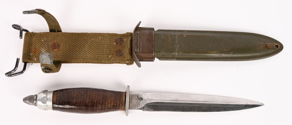WWII US FIGHTING KNIFE MADE FROM M1918 AU LION WW2: A very attractive Fighting Knife converted from a M1918 Brass Knuckle Knife by Au Lion. The still retained the Skull Crusher but replaced the Brass Handle to a Leather Washer Handle. The knife is