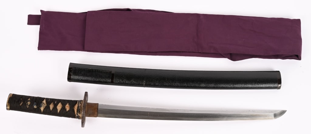 JAPANESE SIGNED WAKIZASHI W SAYA KUISHIGE EDO: Japanese Wakizashi that is signed Kunishige with a 15 inch cutting blade that is still in high polish. The sword is housed in a black lacquered Saya with a silk bag.