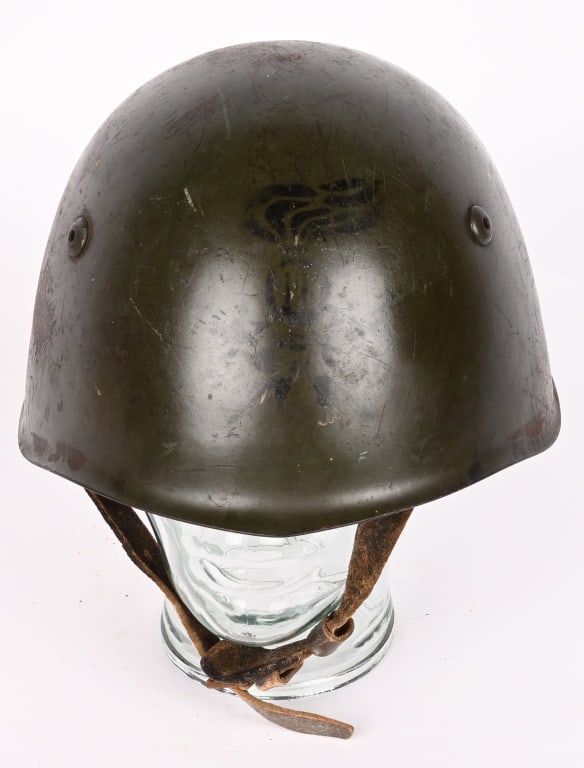 WWII ITALIAN UNIT MARKED HELMET W LINER CHINSTRAP: WWII Italian combat helmet is complete with liner and chinstrap. To the front is a unit painted insignia of the 11th Combat Engineers. Excellent. Dating back from 1925, the Italian Army had engag