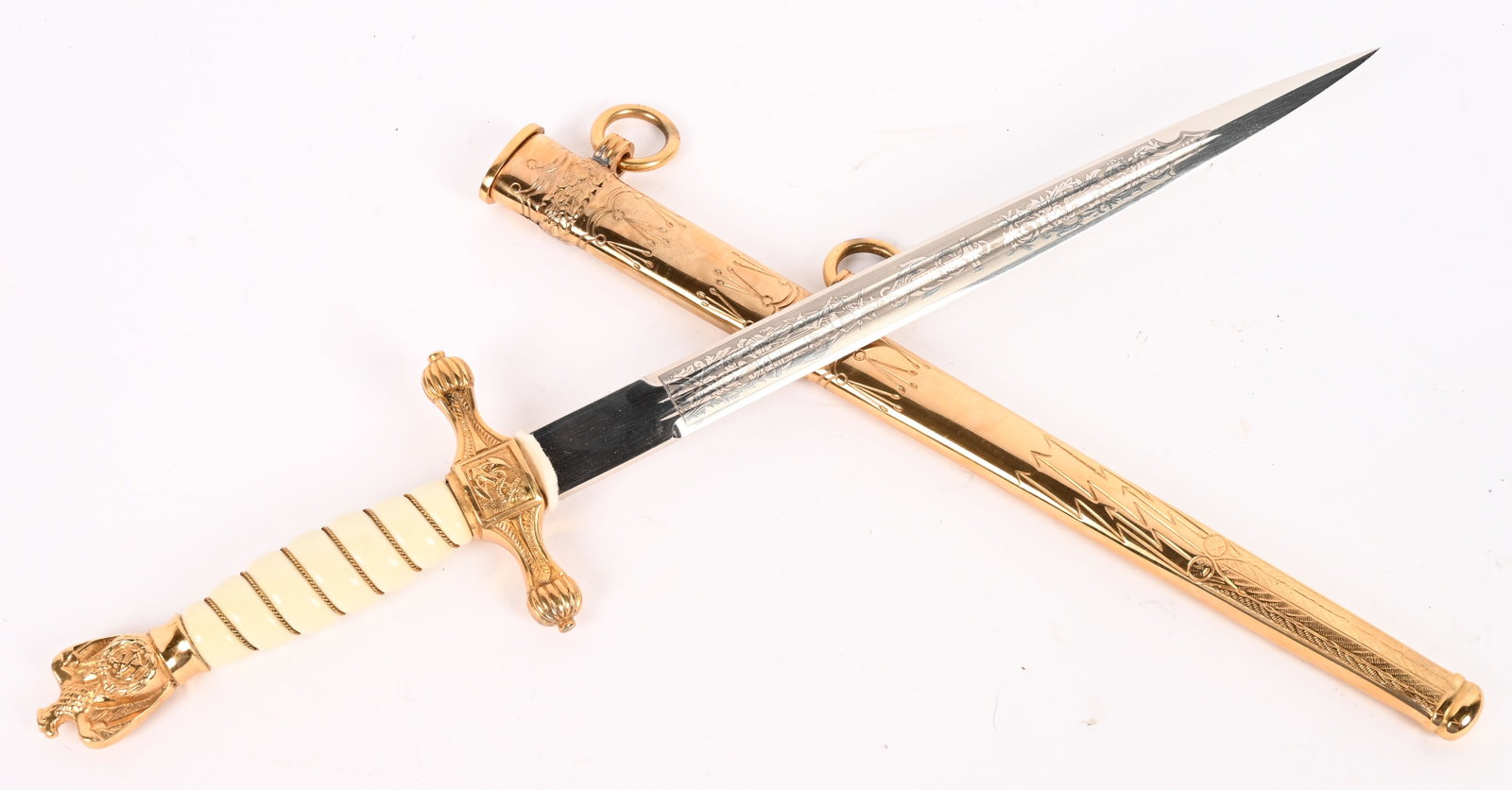 POST WWII KRIEGSMARINE DAGGER BY E. & F. HORSTER: Post WWII Kriegsmarine Dagger by E. & F. Hörster. The blade is in very good condition with crisp etchings on both sides depicting a naval motif. The etchings retain all of the original darkening, and
