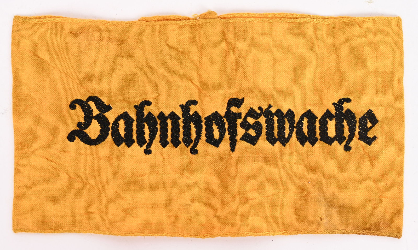 WWII NAZI GERMAN BAHNHOFSWACHE ARMBAND WW2: Railway station guards armband. Yellow rayon construction with a "Bahnhofswache" machine woven in black threads. Hard one to find. Excellent.
