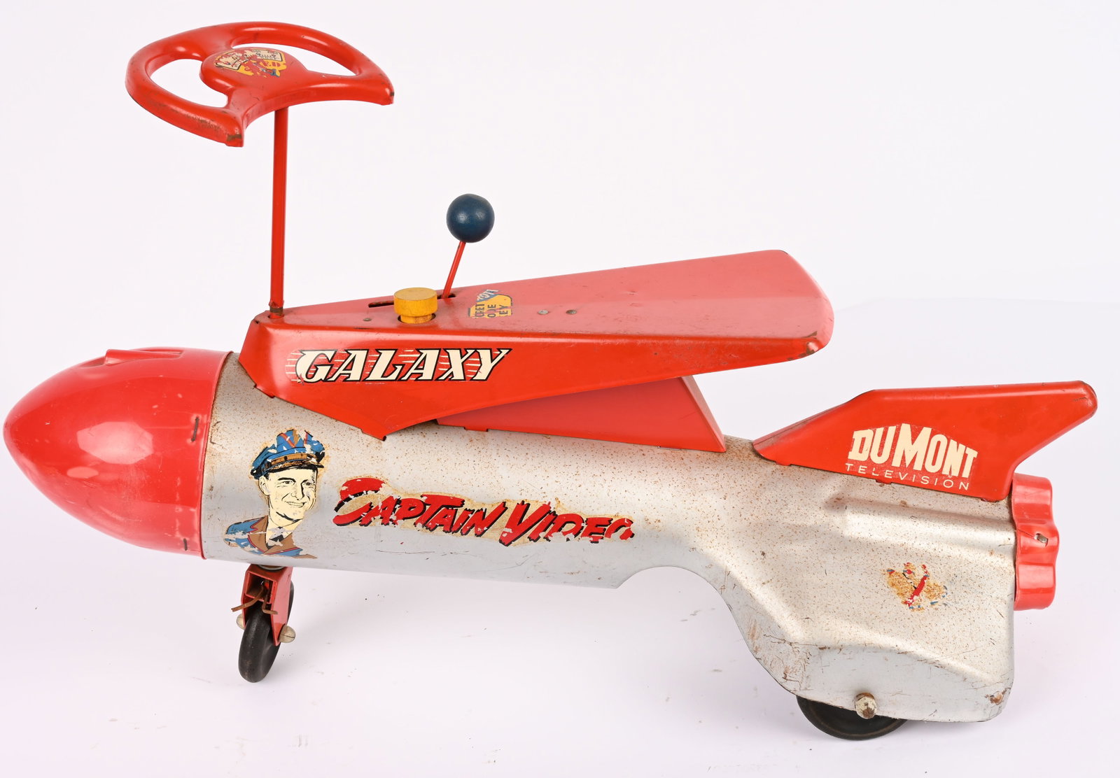 ROBERTS CAPTAIN VIDEO GALAXY RIDE-ON ROCKET: Scarce Roberts pressed steel Captain Video Galaxy Ride-On Rocket. All original and complete. Has decent paint and decals. Has Dumont Television decals on tail fin. Very hard to find pressed steel