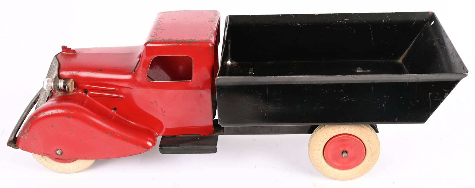 WYANDOTTE DUMP TRUCK w/ ELECTRIC LIGHTS: Wyandotte pressed steel Dump Truck with Electric Headlights. Great looking Rooster Comb style truck. All original with very nice paint. Still has original white rubber tires. Very nice truck. 15"