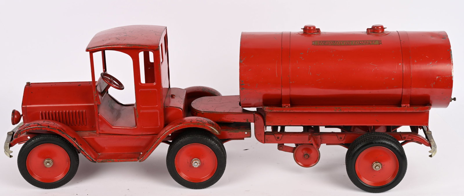 STURDITOY TRACTOR TRAILER OIL TANKER: Sturditoy pressed steel Tractor Trailer Oil Tanker. Outstanding all original with exceptional paint and decals. Has original spigot missing down spouts. A very rare and desirable truck. One of there